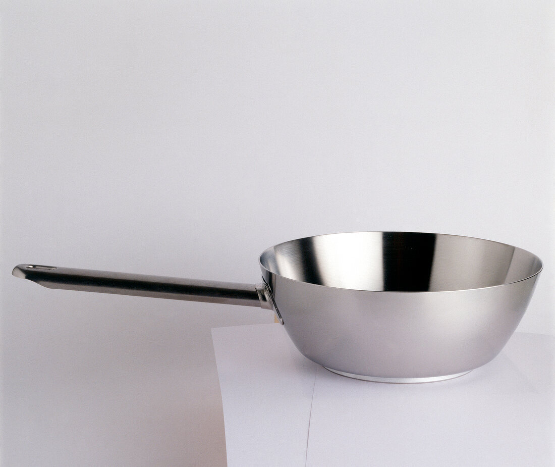 High edge saute pan on white background