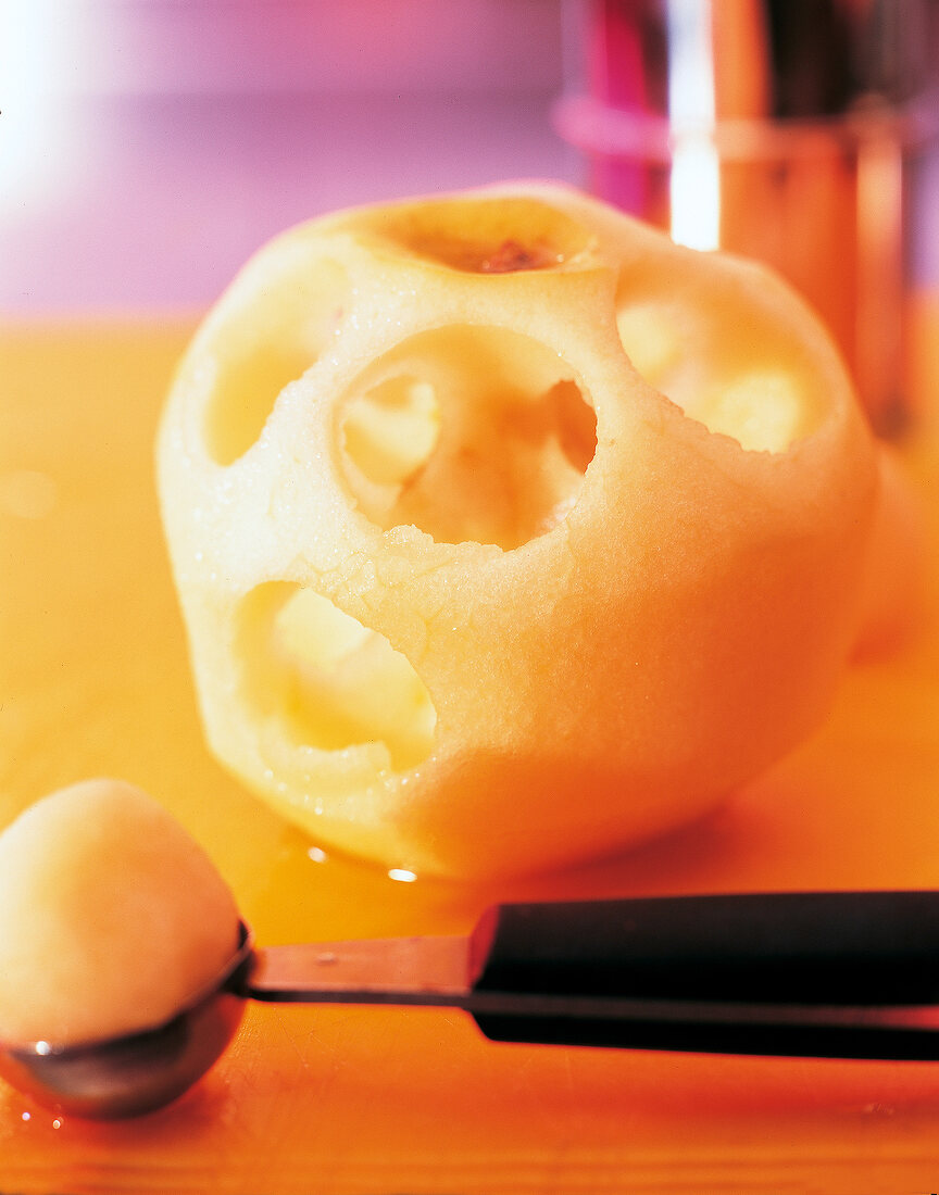 Close-up of apple hollowed out with a melon baller