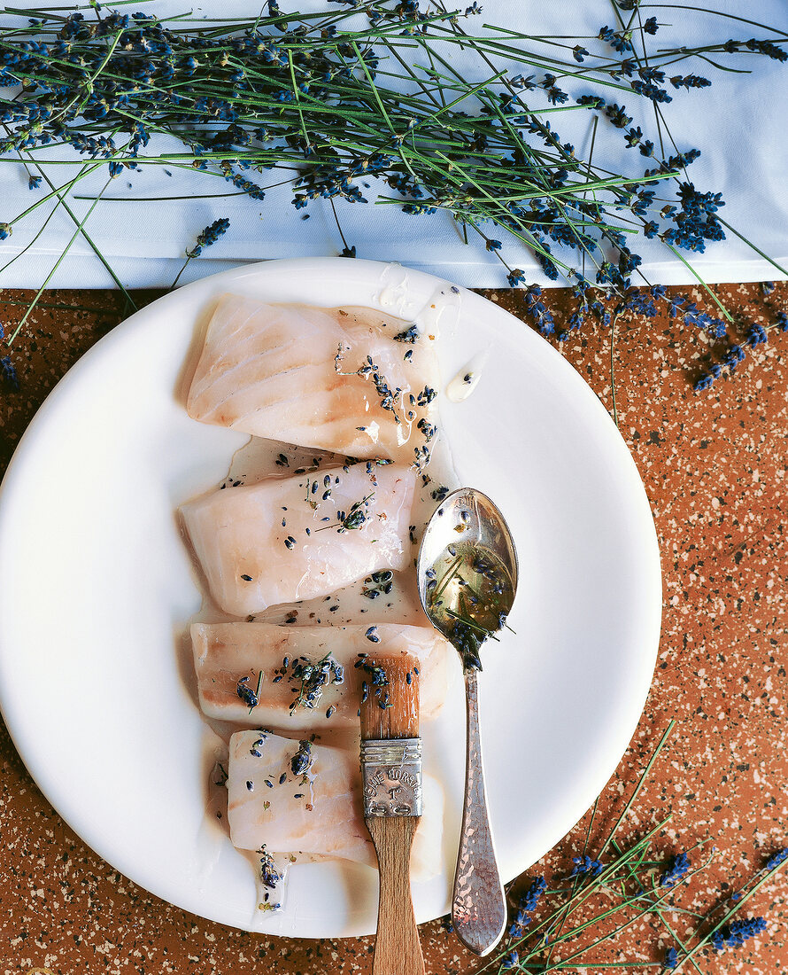 Turbot fillet coated with lavender honey before frying on plate