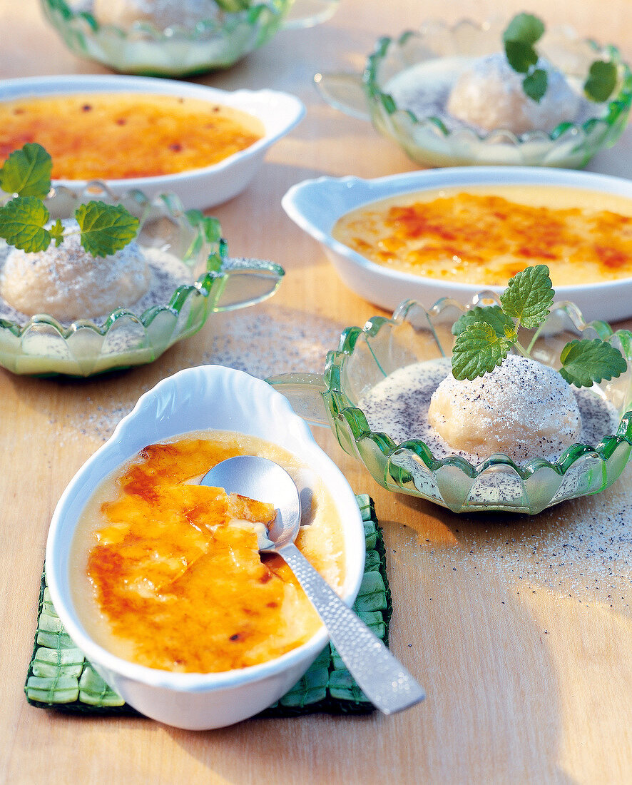 Creme brulee on serving dish and mini-yeast dumplings with poppy seed sauce in bowl