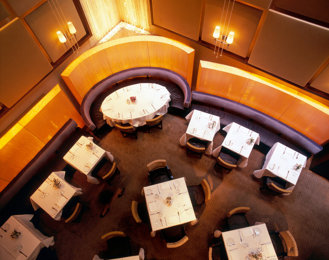 Laid tables in restaurant of Chambers Hotel, New York, Overhead view