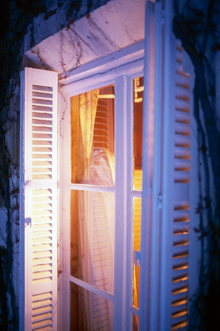 Window with open shutters in Domaine de la Tortiniere France