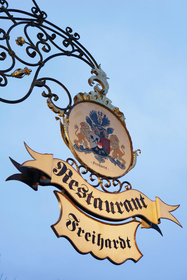 Close-up of restaurant signboard, Germany