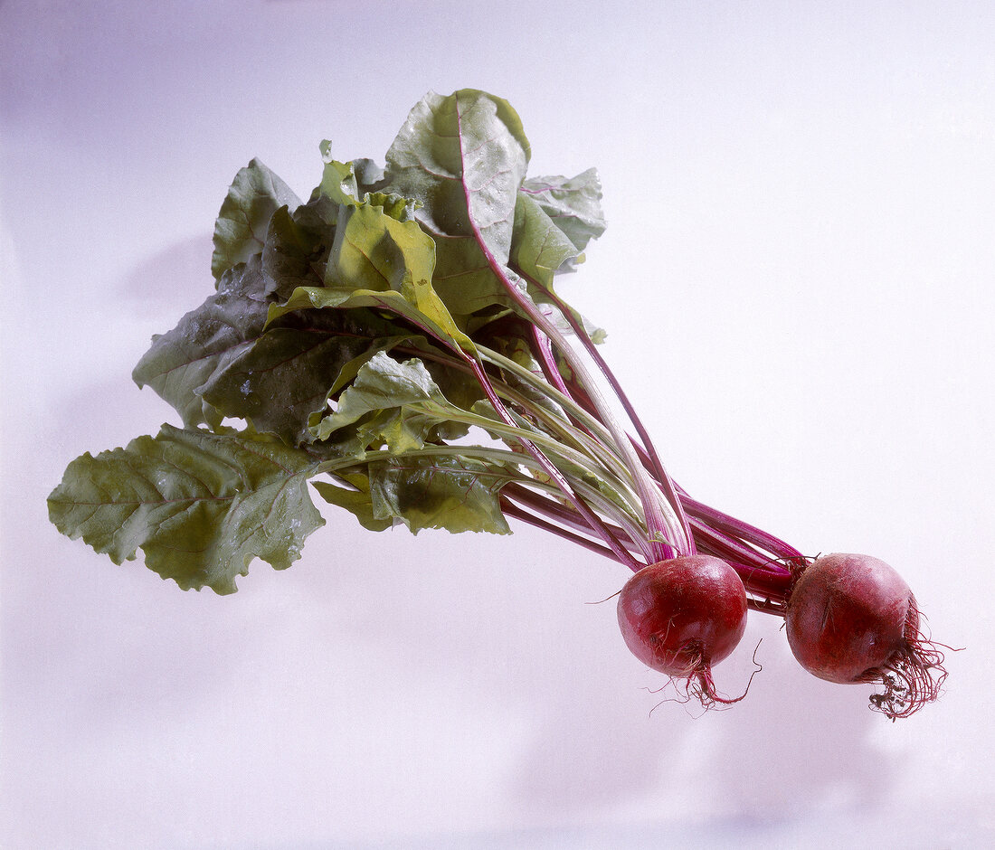 Two beetroots on white background