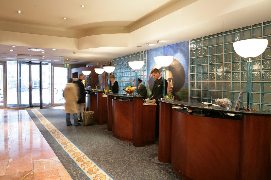 Guests at reception of hotel, Germany