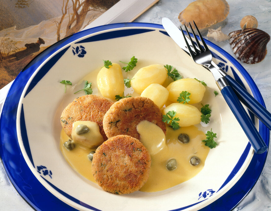 Fish cake rissoles on plate