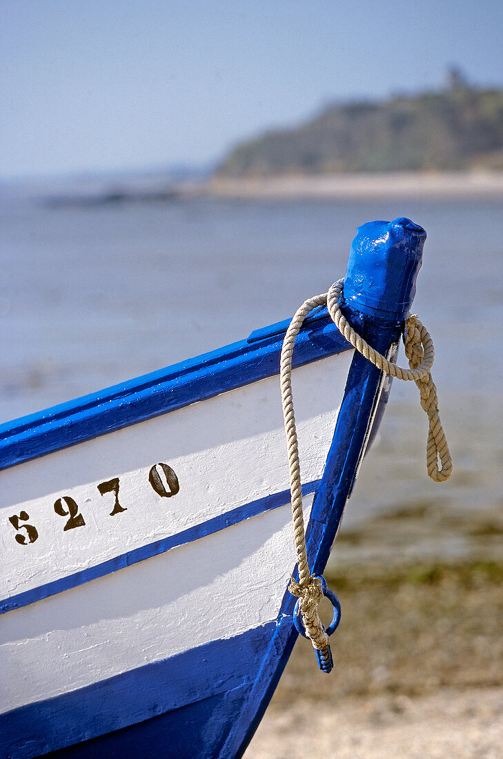 Close-up of the bow of fishing boat on beach at Cancale, Brittany, France