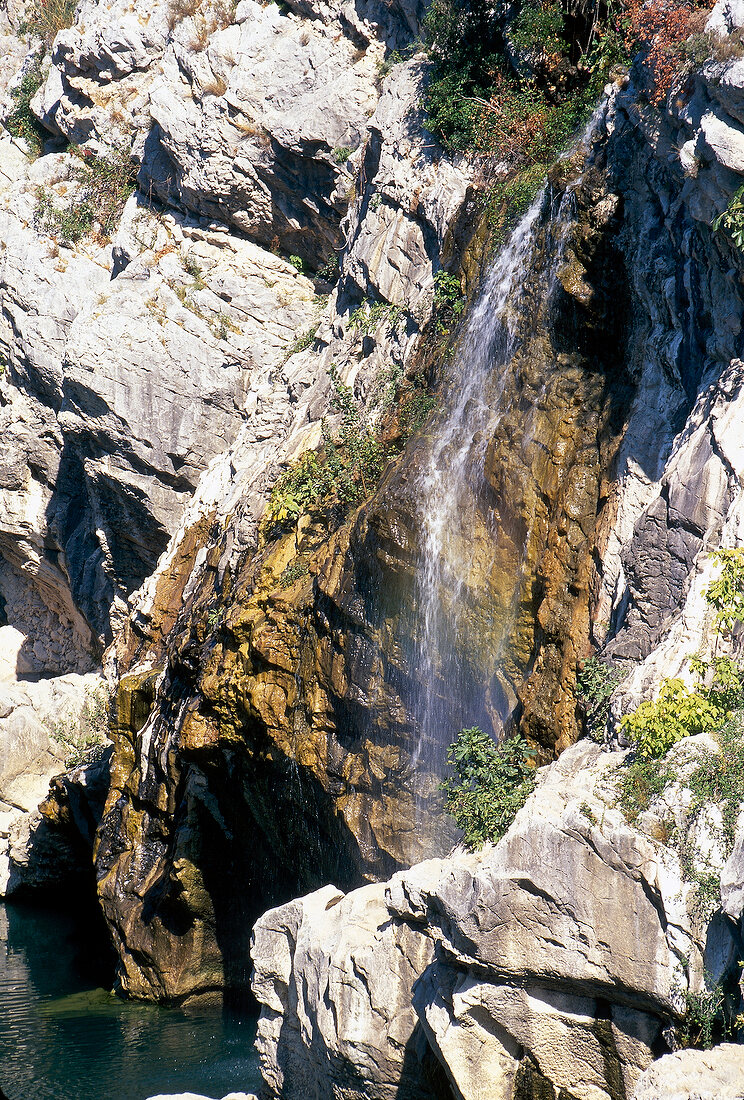 View of waterfall through rock in Languedoc, France