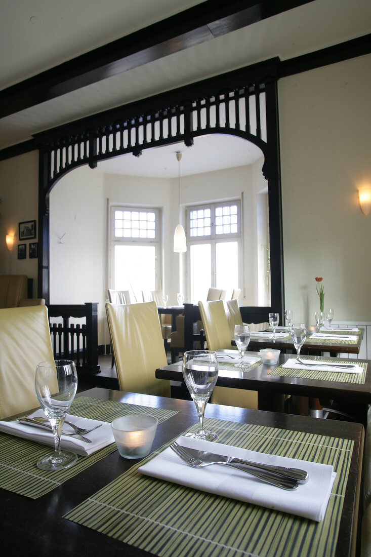 Interior of restaurant with laid tables in Germany