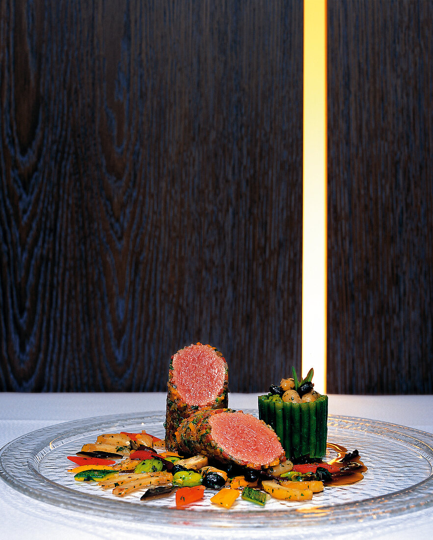 Pauillac lamb with Mediterranean vegetables on glass plate