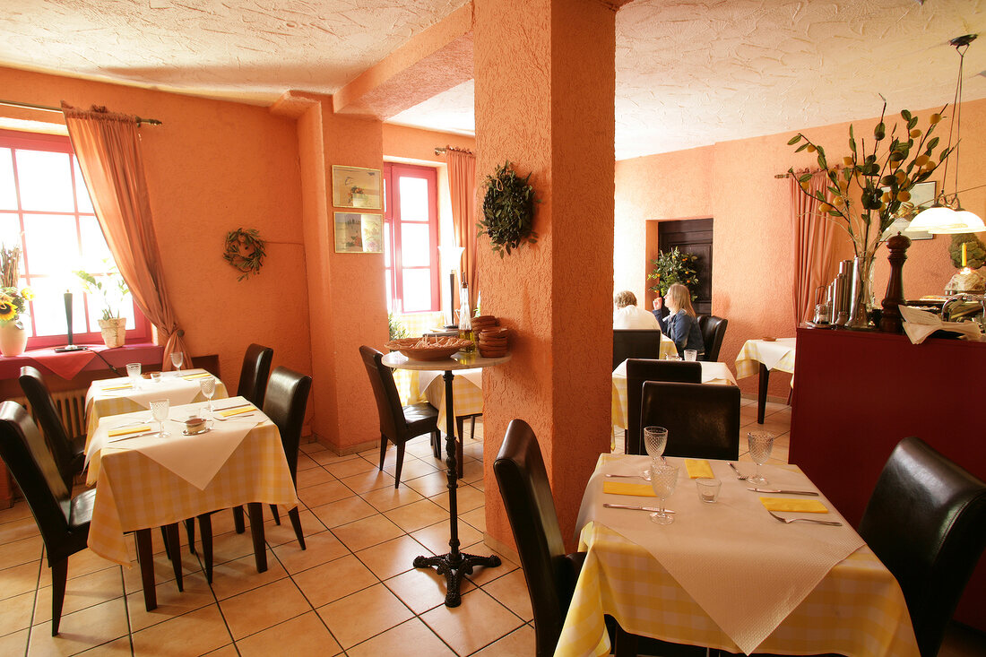 Interior of restaurant with laid tables in Germany