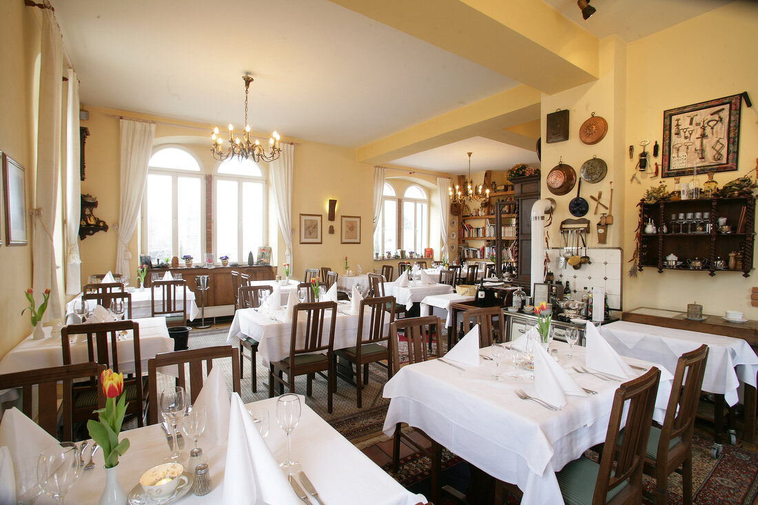 Interior of restaurant with laid tables in Germany