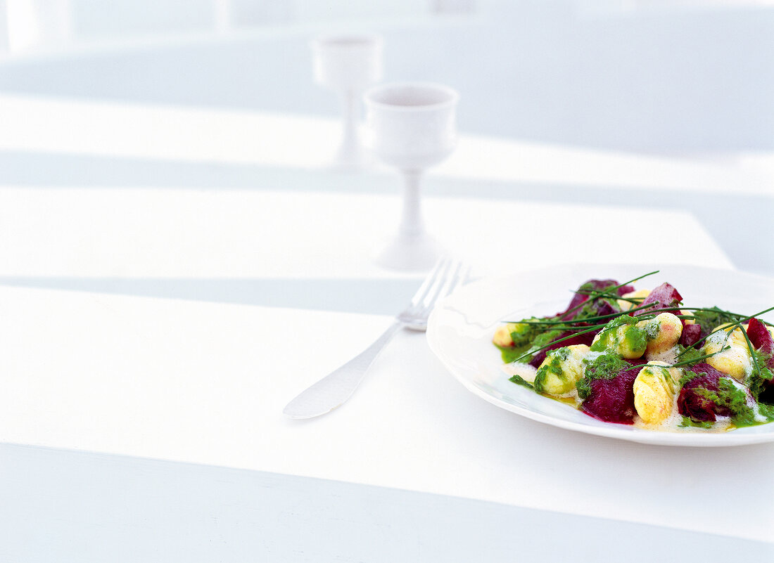 Potato gnocchi with beetroot cooked in sea salt with potato gnocchi on plate