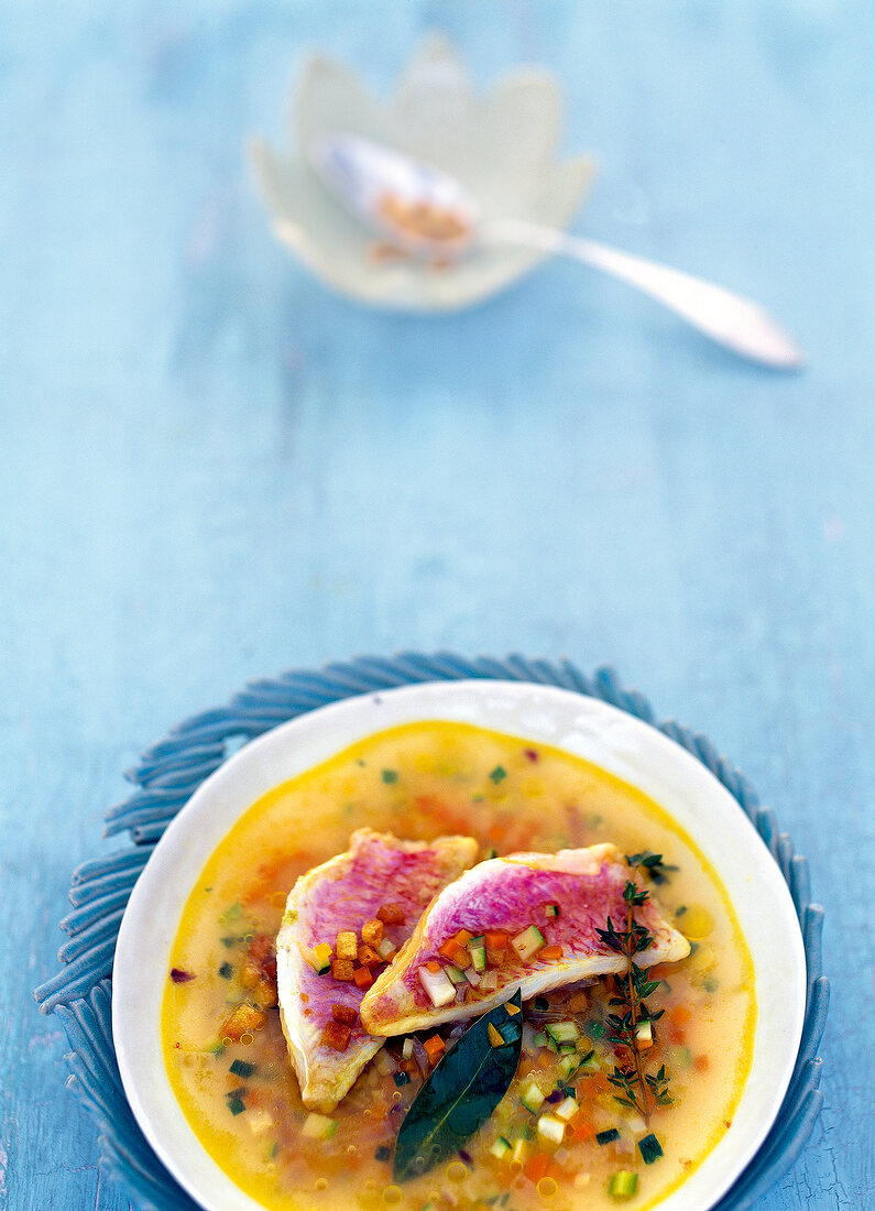 Pistou soup with red mullet on plate