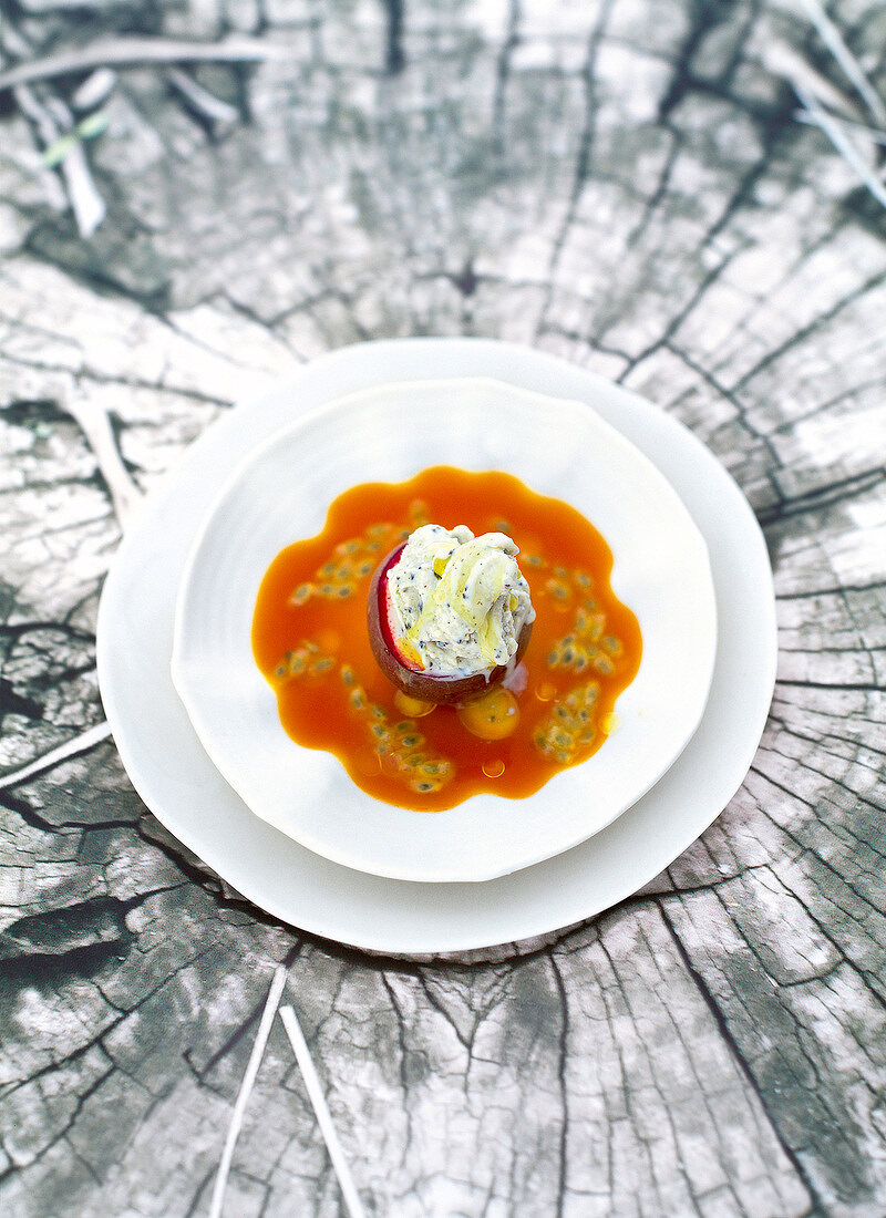 Olive ice cream with passion fruit gazpacho served on plate