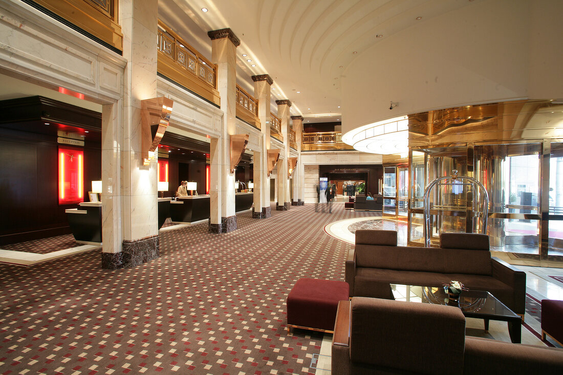 Interior of hotel with reception counter and sitting area, Germany