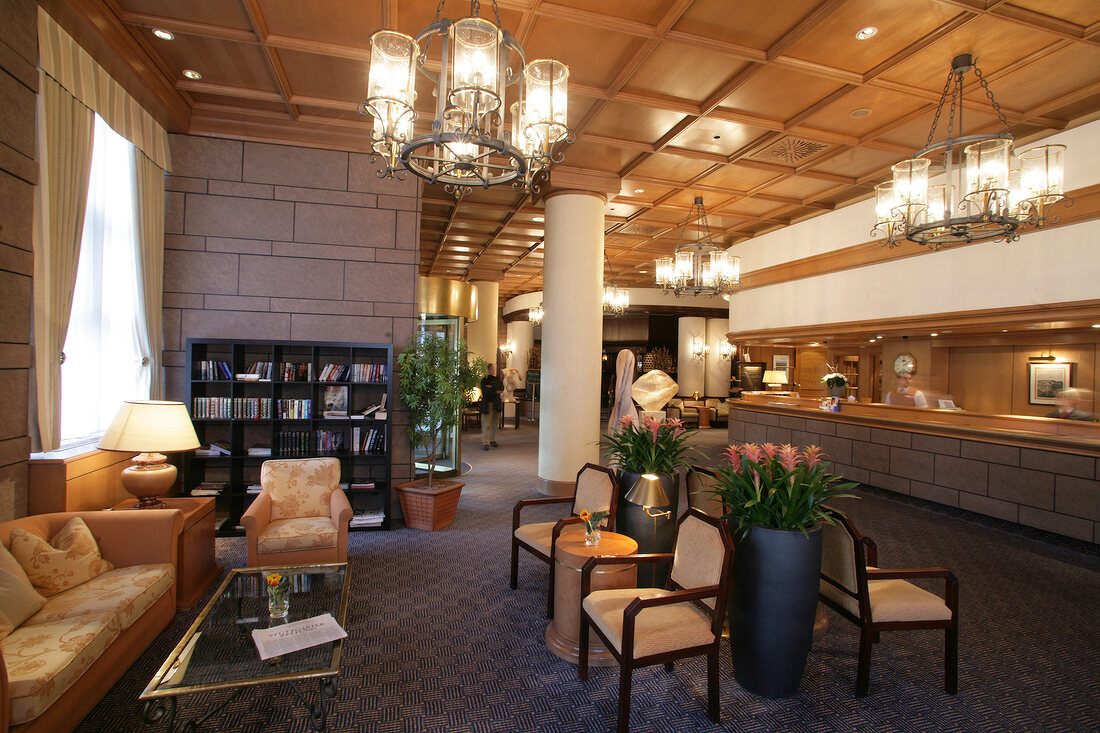 Interior of hotel with reception counter and sitting area, Germany