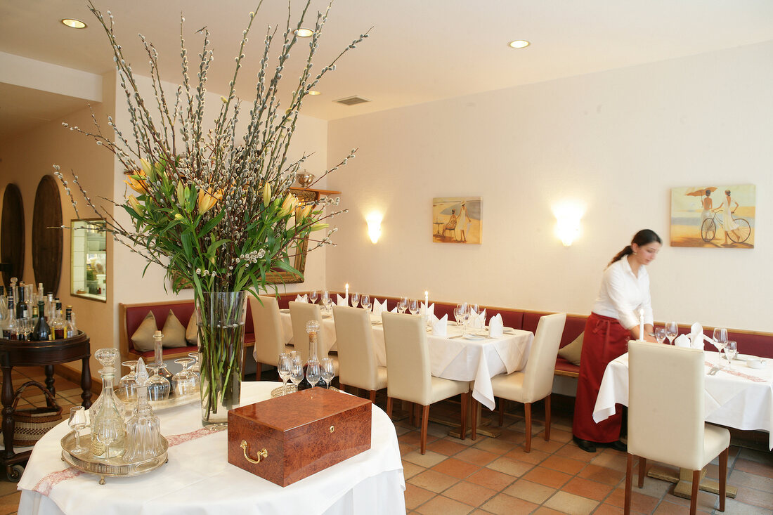 Bouquet of flowers on laid table in restaurant, Germany