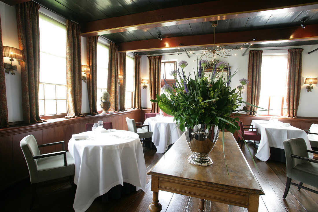 Dining table and bouquet in hotel, Netherlands