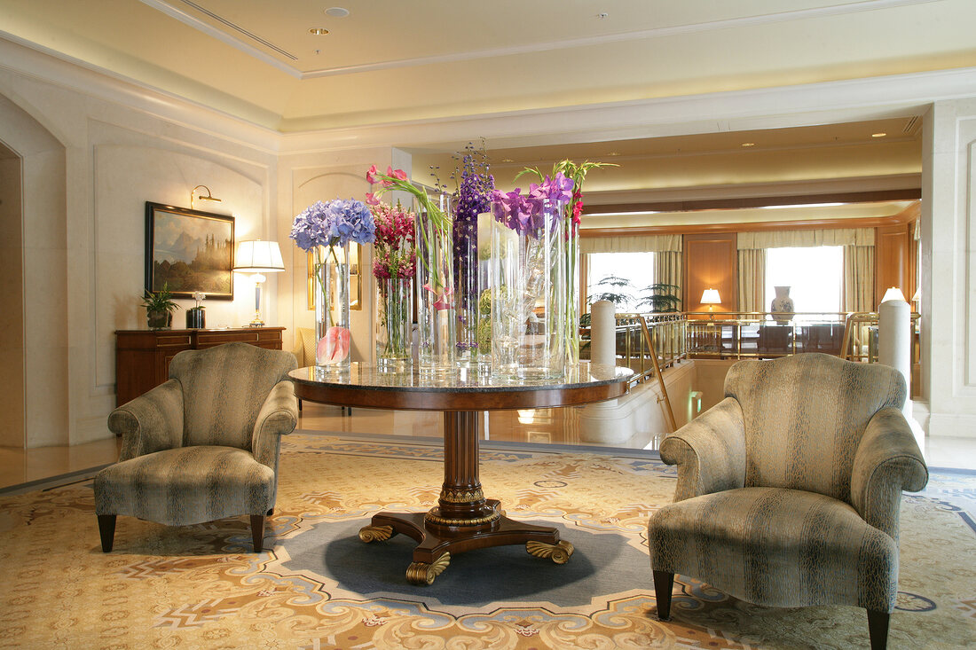 Interior of hotel with flower vases and chairs, Czech Republic