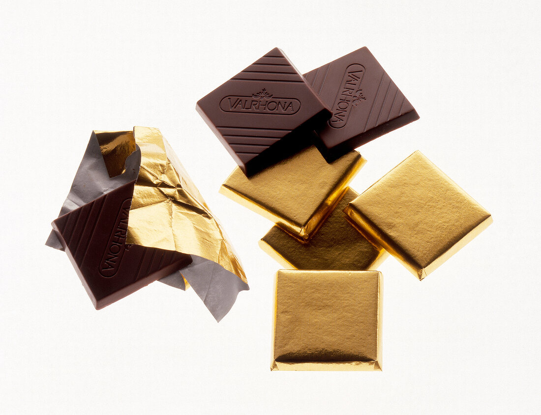 Chocolates pieces with and without golden packaging