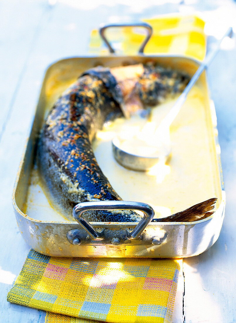 Salmon with cream shallots in roasting pan