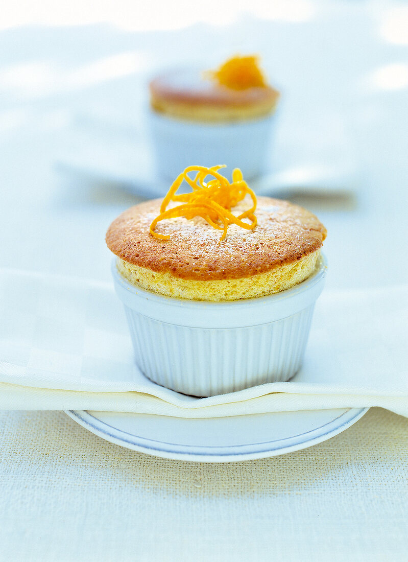 Orange souffle in cake case on plate