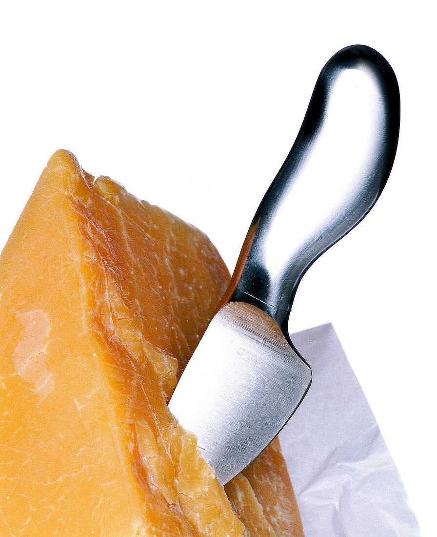 Close-up of parmesan cheese with cheese knife