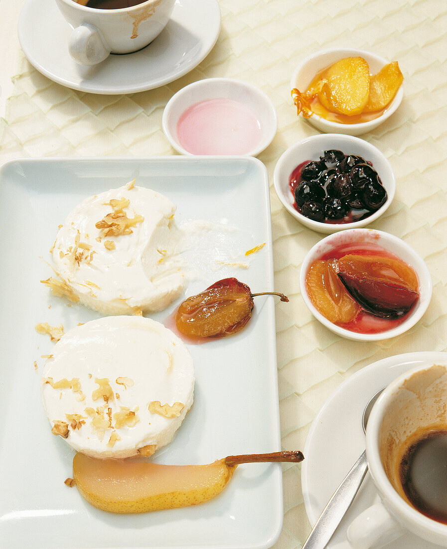 Fresh cheese made from orange yogurt with fruits on plate