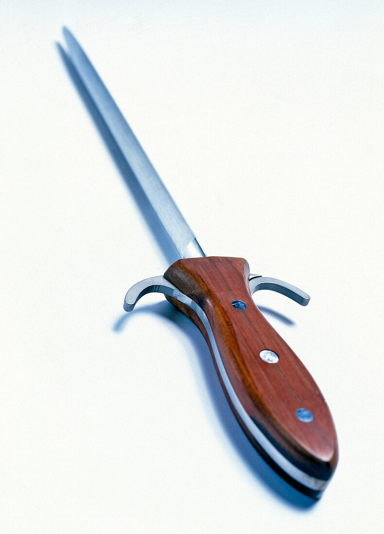 Close-up of knife on white background