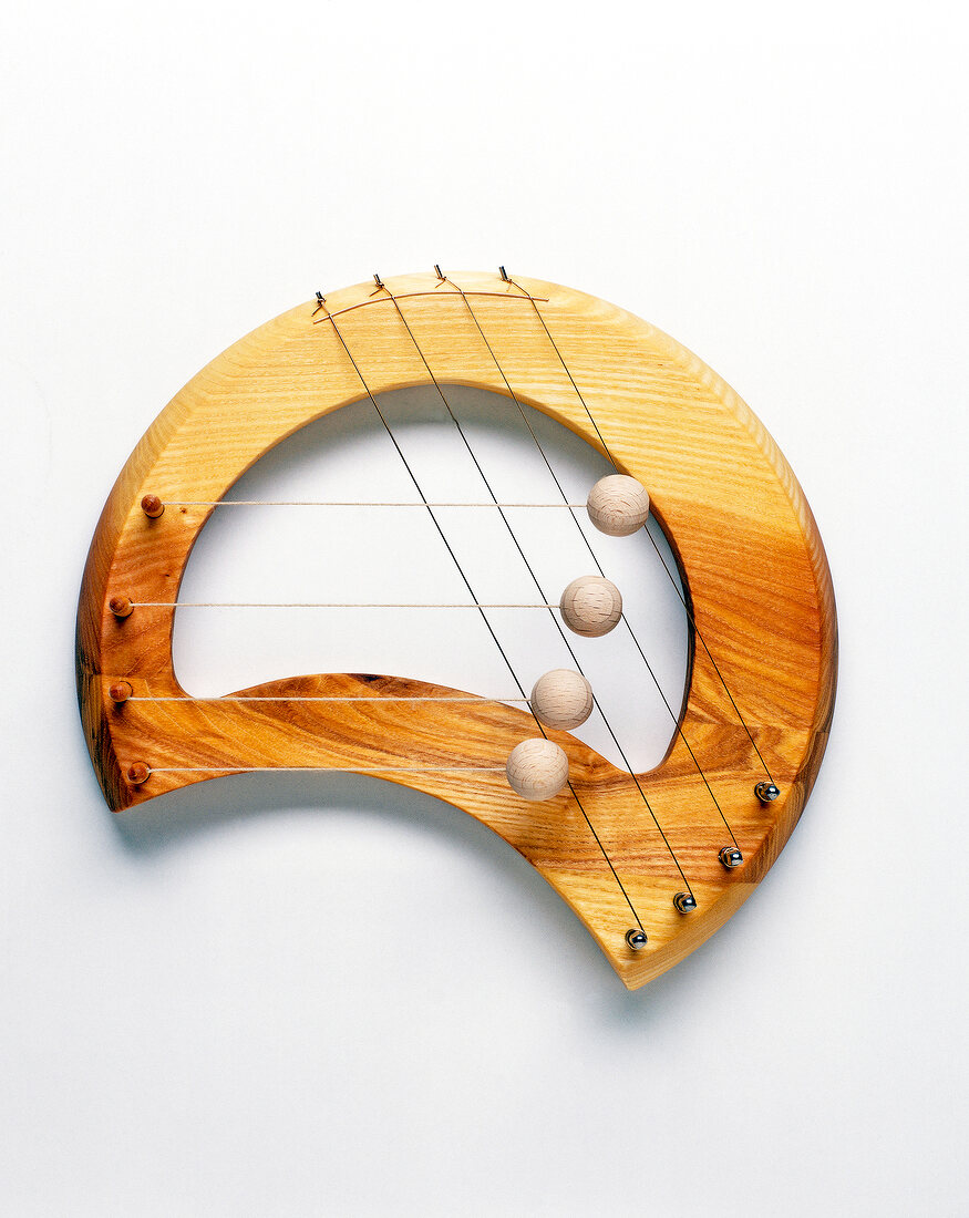Door harp made of ash wood on white background