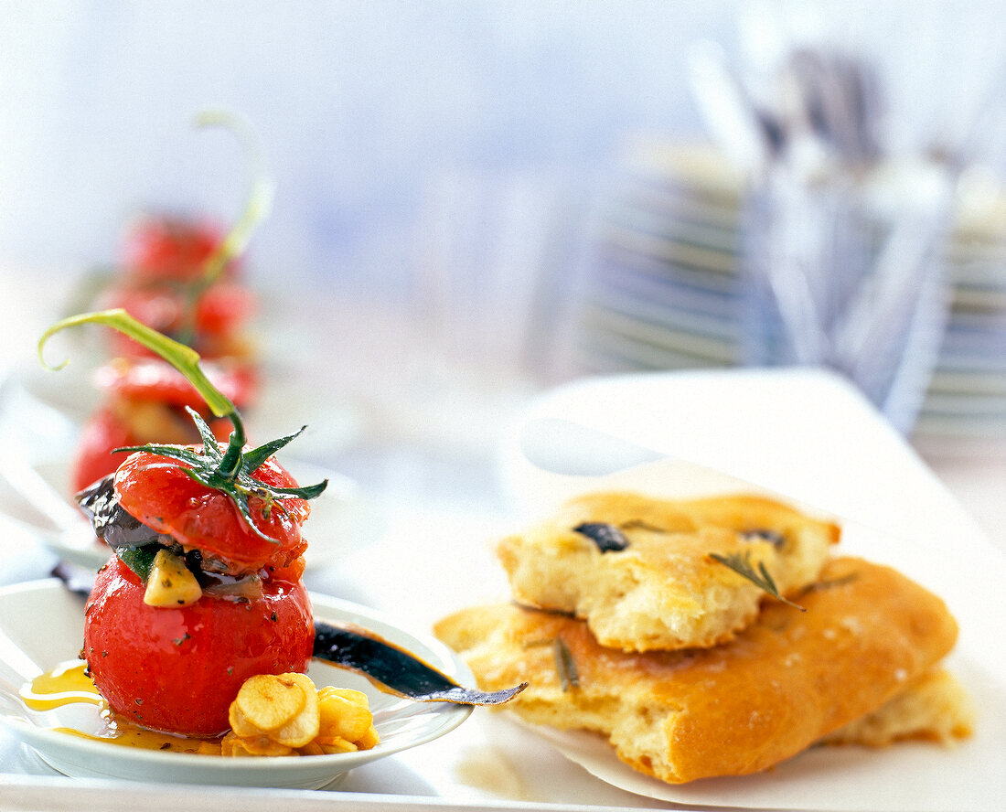 Vegetable confit and stuffed tomatoes on plate