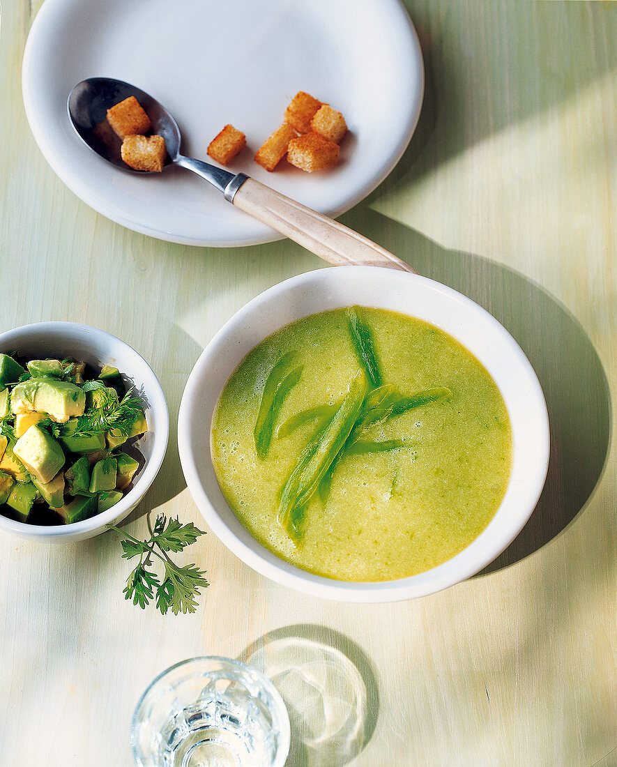 Green gazpacho with avocado and coriander in bowl