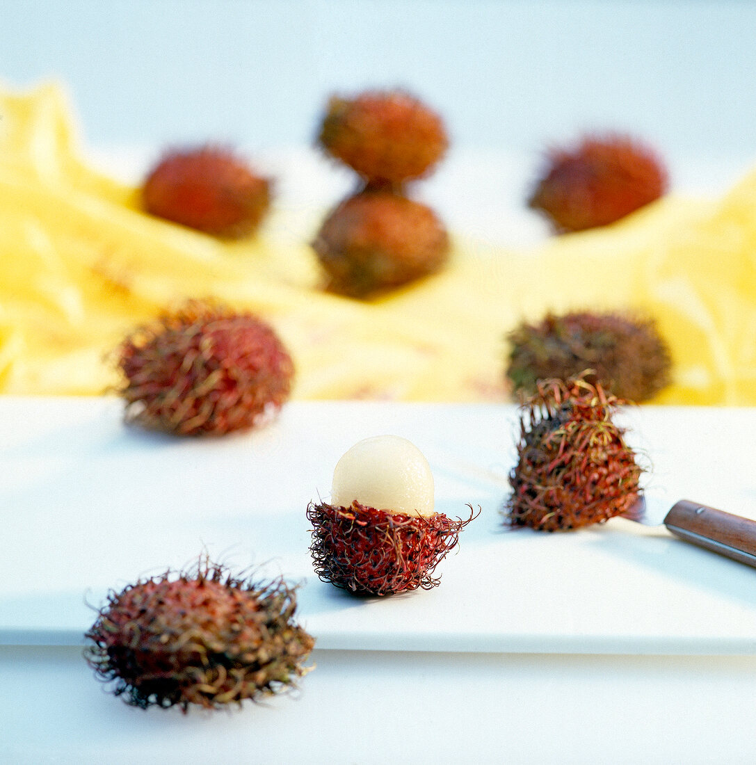 Litchis on chopping board