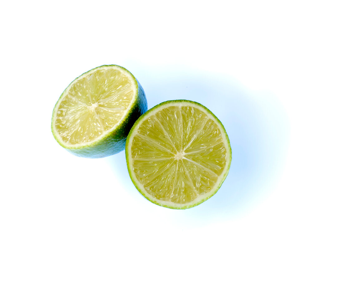 Close-up of halved lemons on white background