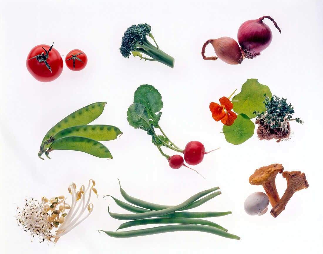 Radish, beans, broccoli, tomatoes and other vegetables on white background