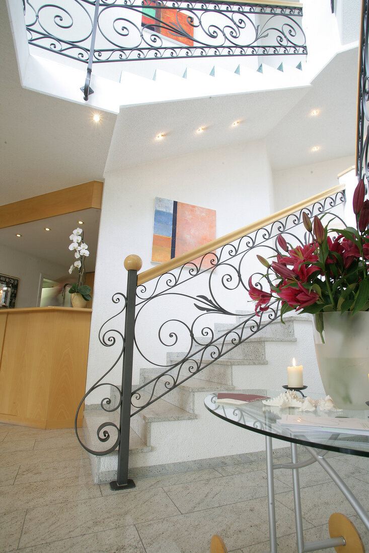 Interior of hotel with reception counter and staircase, Germany