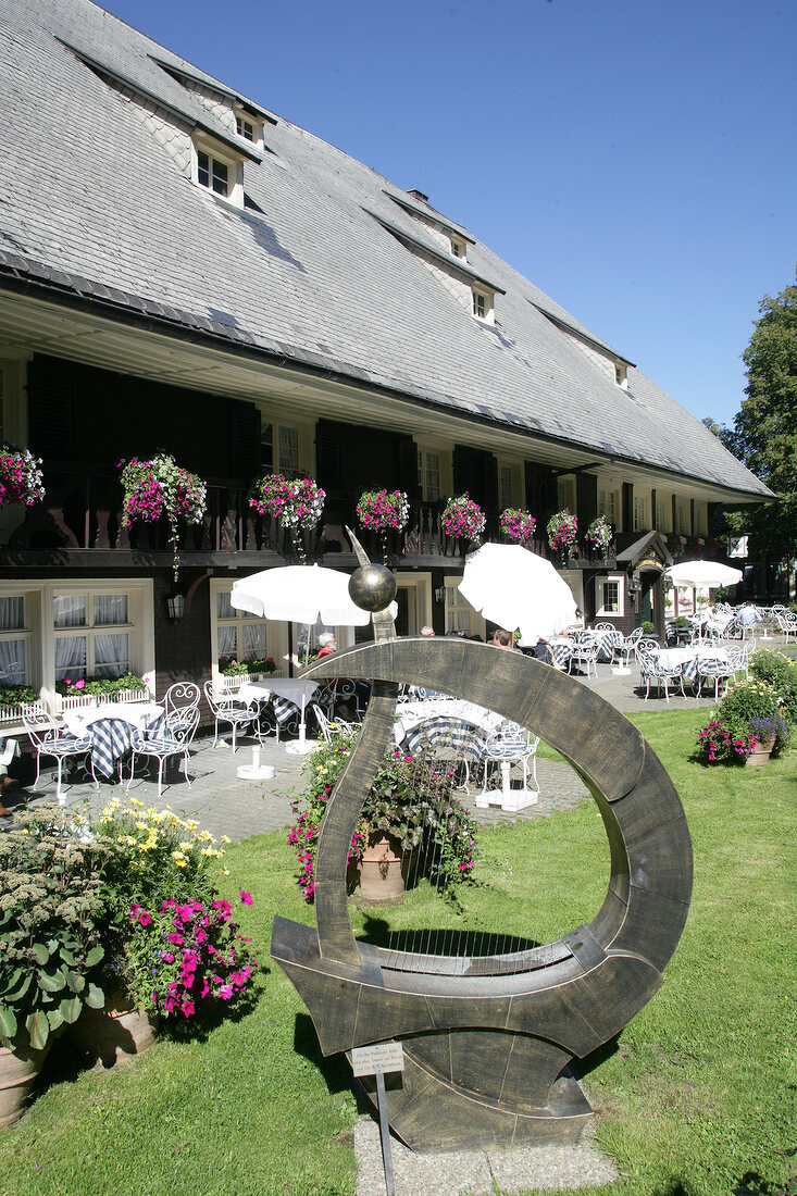 Garden and a sculpture outside Eagle Restaurant, Baden-Wurttemberg, Germany