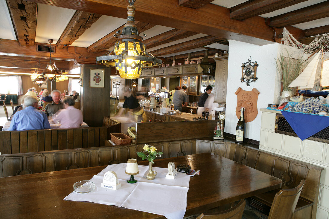 Guests dining in restaurant, Germany
