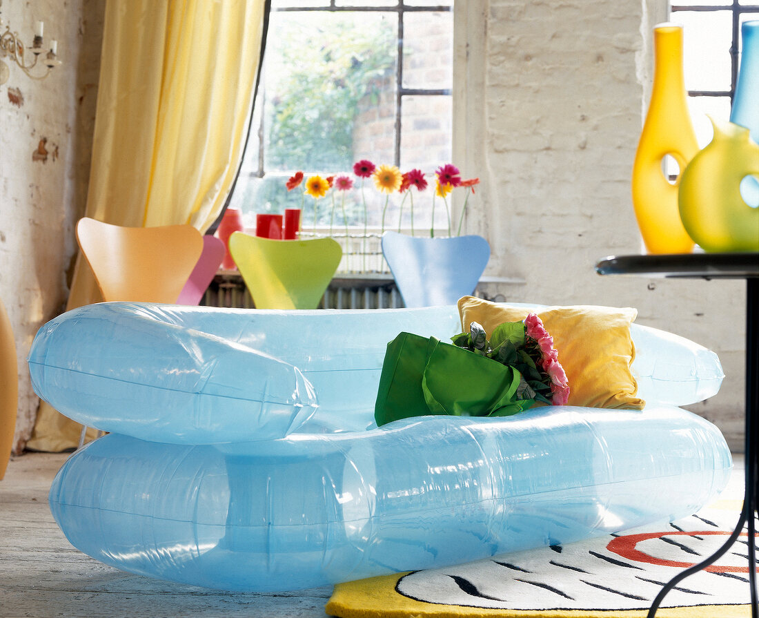 Light blue inflatable sofa with cushion