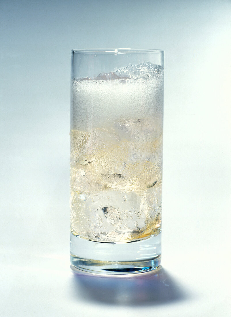 Champagne with ice on white background