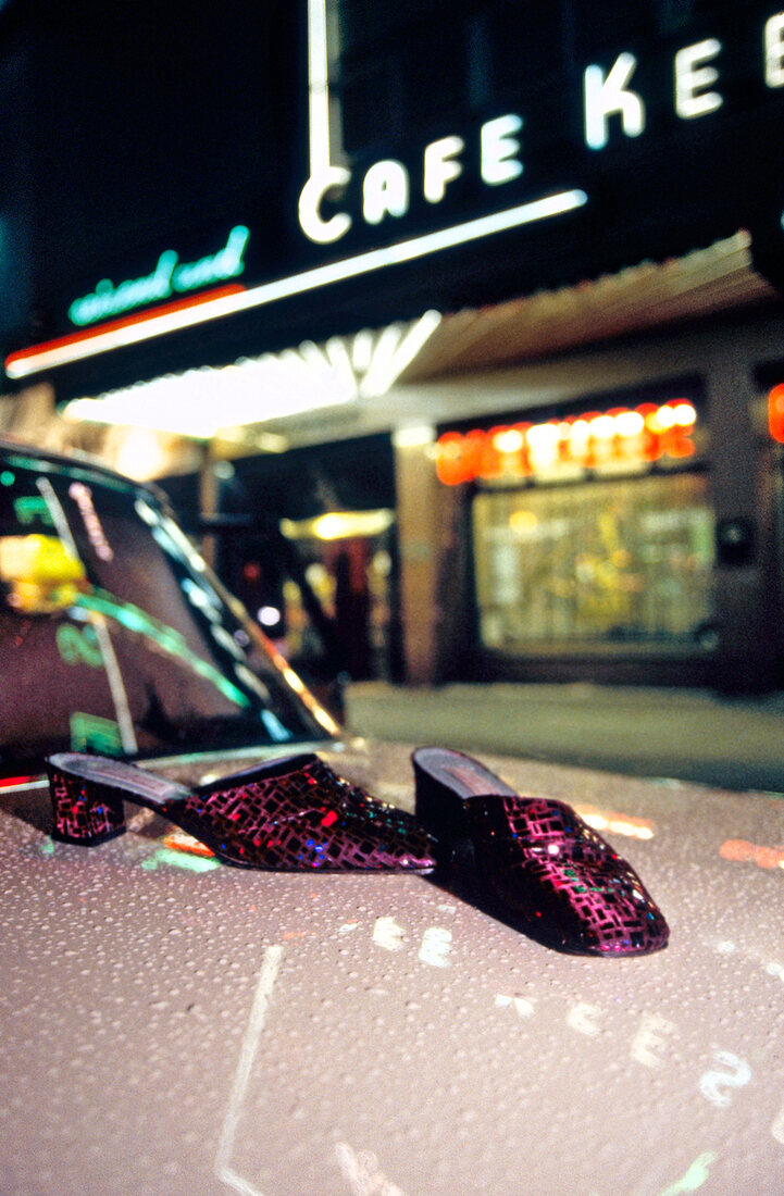 Mules with sequins on the hood of the car