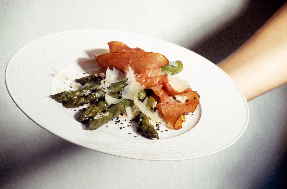 Milanese green asparagus rolls on plate