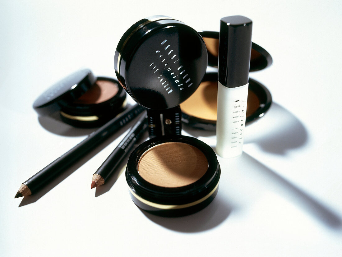 Eye shadow, eyeliner mascara and various cosmetics on white background
