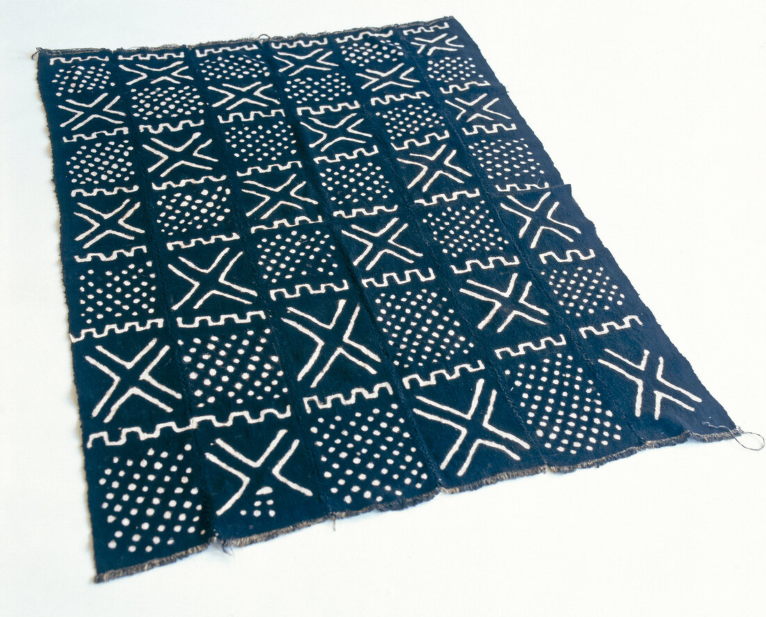 Close-up of black and white pattern rug in ethnic look on white background