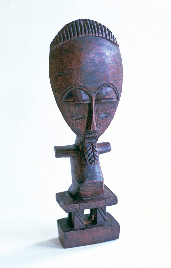 Black fertility doll made of osage wood in ethic style