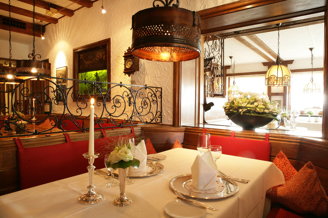 Interior of restaurant with dinning tables and lantern, Germany