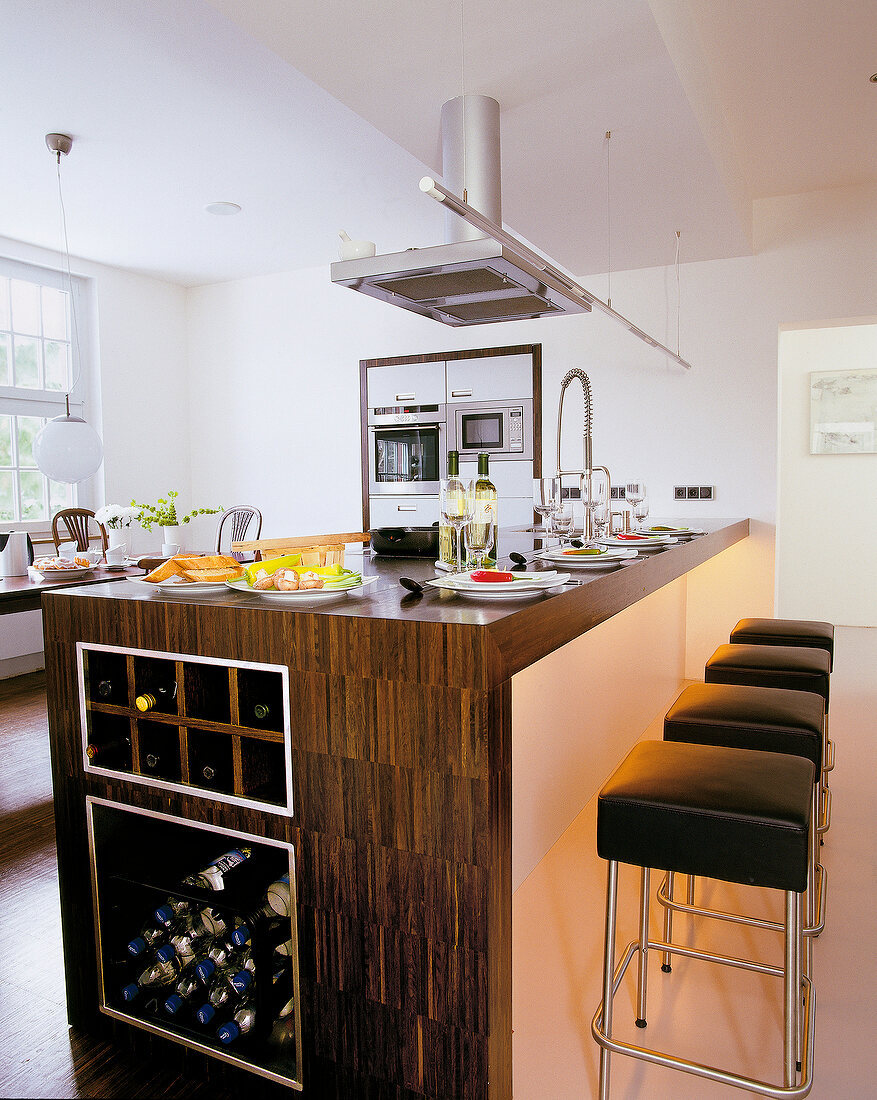 Kitchen counter and leather stools in kitchen