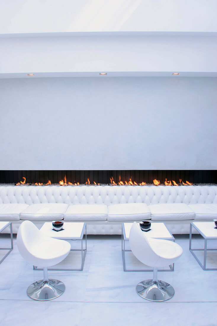 Laid tables at bar in Murano Resort, Paris, France