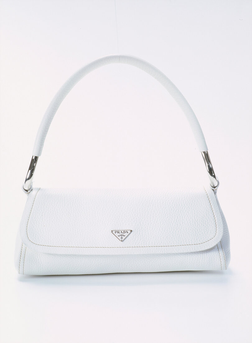 Close-up of white handbag on white background